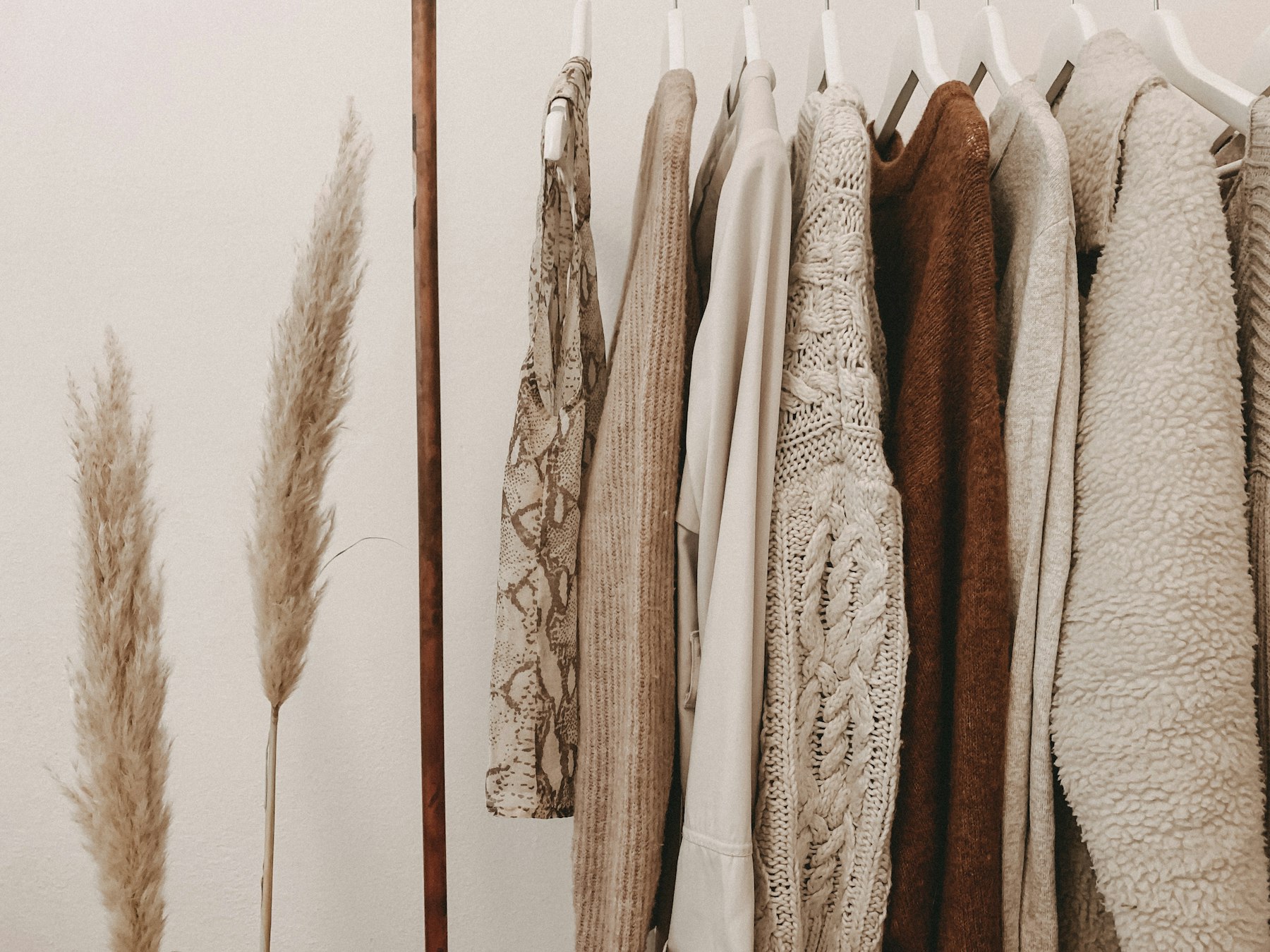 Direction A — cinematic mill, hanging knits