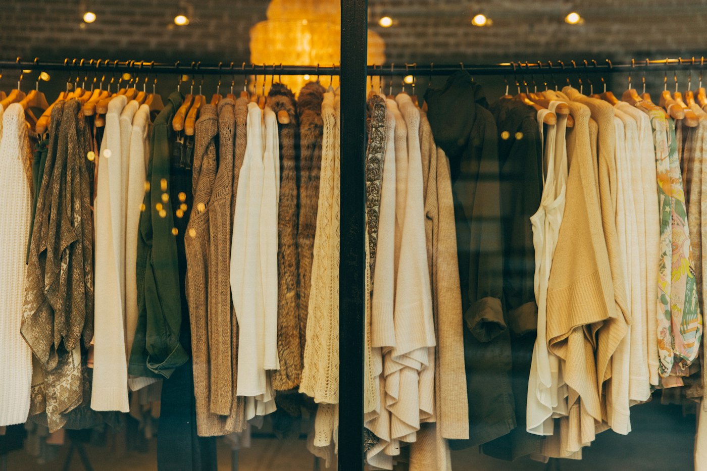 Garments hanging on a wooden rail